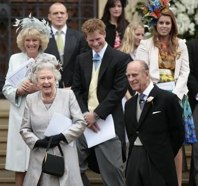 File photo dated 17/05/08 of (left to right) The Duchess of Cornwall, Queen Elizabeth II, Mike Tindall, Prince Harry, Zara Phillips, The Duke of Edinburgh and Princess Beatrice leaving the St George"s Chapel in Windsor after attending the marriage ceremony of Mr Peter Phillips and Miss Autumn Kelly.