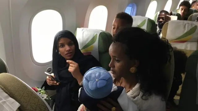 ተጓዦች አውሮፕላን ውስጥ