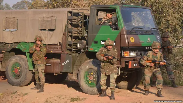 Indian army soldiers take up position on the perimeter of an airforce base in Pathankot on January 3, 2016.
