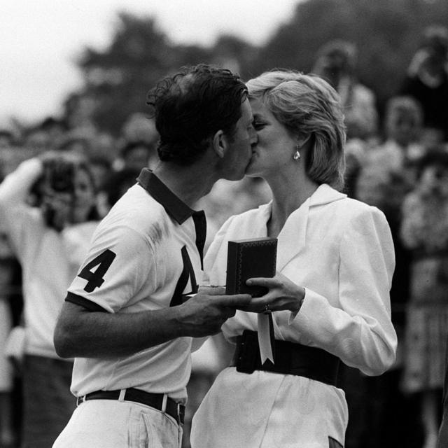 Princess of Wales presenting her husband, the Prince of Wales, with a prize and a kiss
