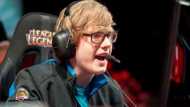 Maurice Stückenschneider of team Origen wearing a headset and talking into a microphone at the 2015 League of Legends All-Star Event in Los Angeles