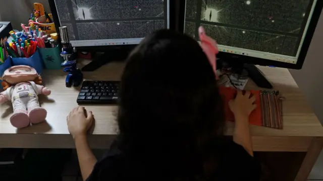 Nicole on her computer