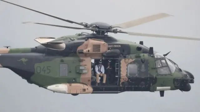 Perdana Menteri Scott Morrison terbang di atas kebakaran semak di NSW pada tanggal 23 Desember.