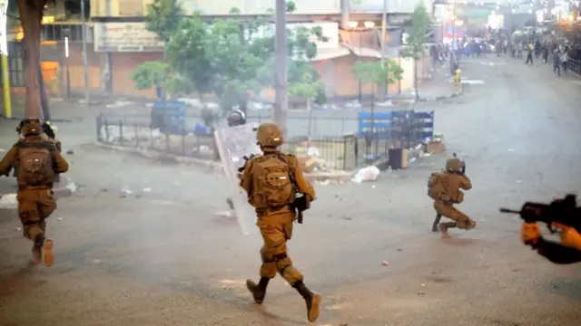 Israeli forces intervene in Palestinians who protest against Israeli attacks in Jerusalem and Gaza Strip on May 13, 2021, in Hebron, West Bank.