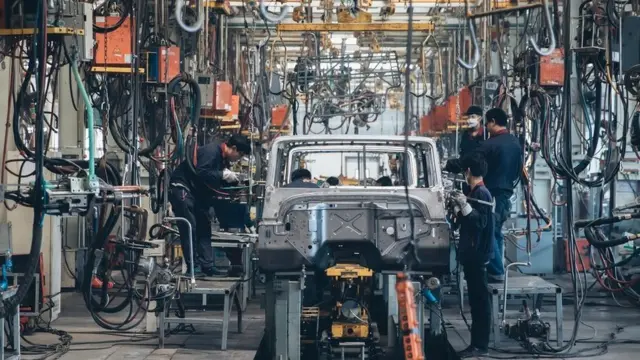 Workers in a car factory in Beijing, China.