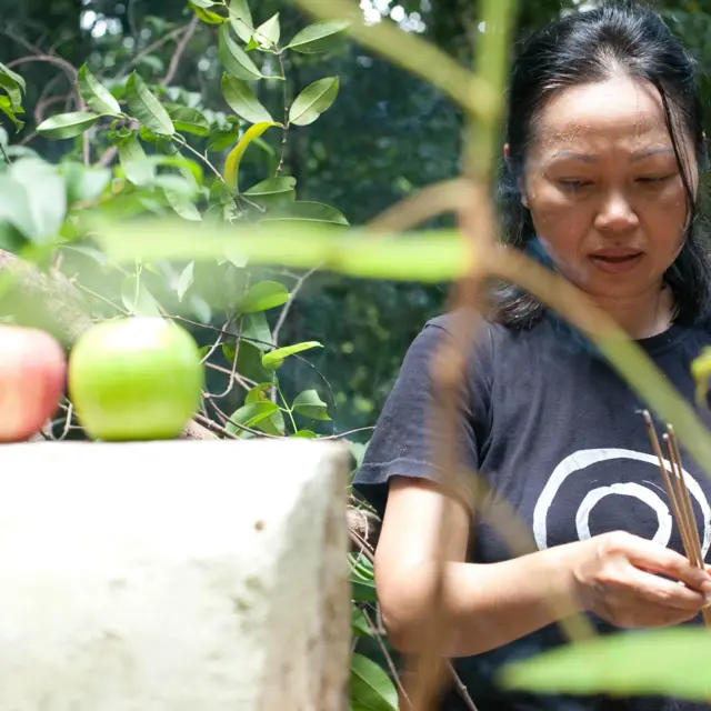 Carina searching for graves in KuKu
