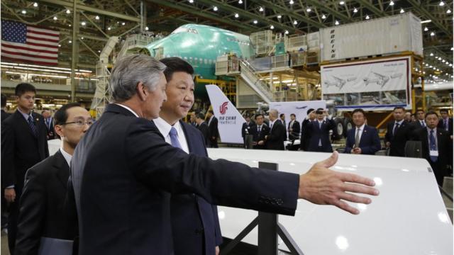 Chinese President Xi Jinping (R) and Ray Conner, president and CEO Boeing Commercial Airplanes, tour the Boeing assembly line on September 23, 2015,