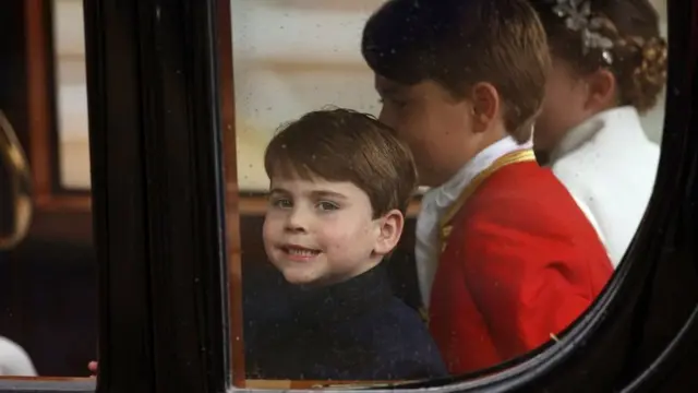 Prince Louis, Page of Honour Prince George and Princess Charlotte of Wales depart the Coronation service of King Charles III and Queen Camilla