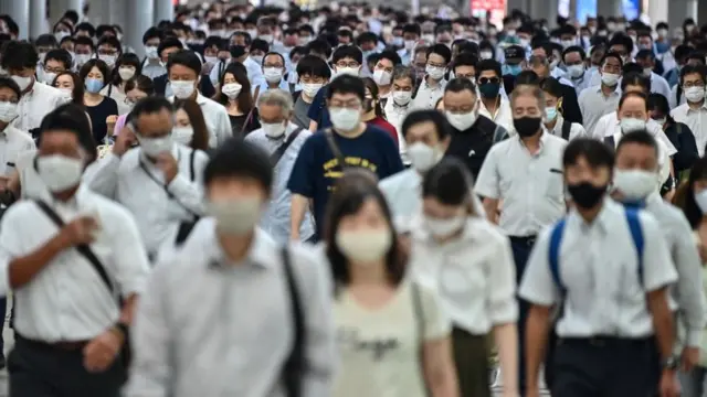 Early morning commuters in Tokyo.