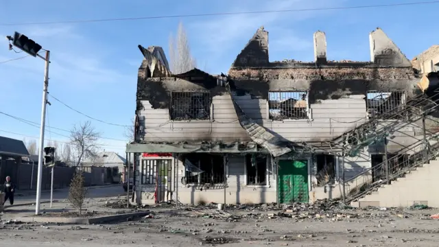 View of burnt houses and property in the village of Masanchi