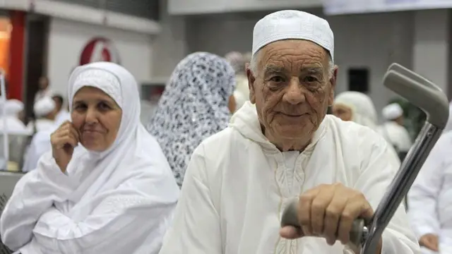 Tunisian prospective pilgrims wait for boarding to the flight for Hajj