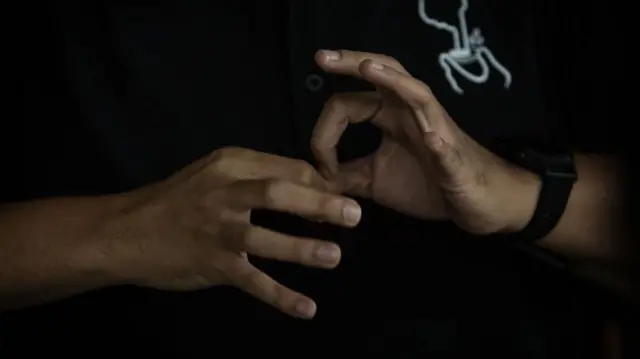 Ilustrasi bahasa isyarat.