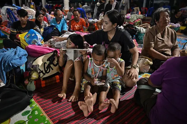 TOPSHOT-THAILAND-CAMBODIA-BORDER-CONFLICT
TOPSHOT - Evacuees displaced by the ongoing conflict between Thailand and Cambodia rest at an evacuation center in the Thai border province of Si Sa Ket on July 26, 2025. Thailand and Cambodia pounded each other with heavy artillery fire for a third day on July 26, as a border conflict that killed at least 33 people and displaced more than 150,000 from their homes spread across the frontier. (Photo by Lillian SUWANRUMPHA / AFP) (Photo by LILLIAN SUWANRUMPHA/AFP via Getty Images)