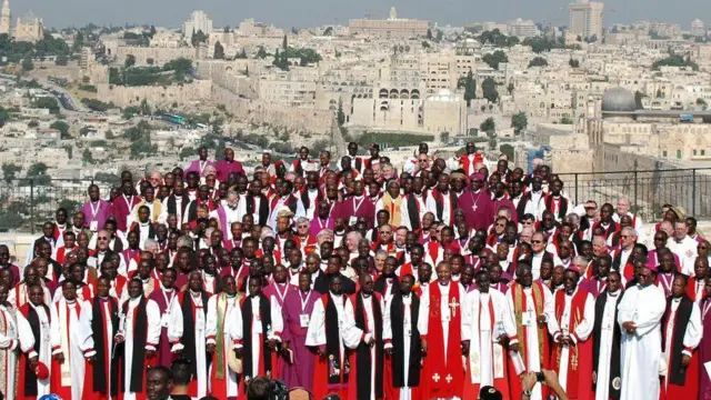 AOne group of Anglican clerics pose for a photo in Jerusalem