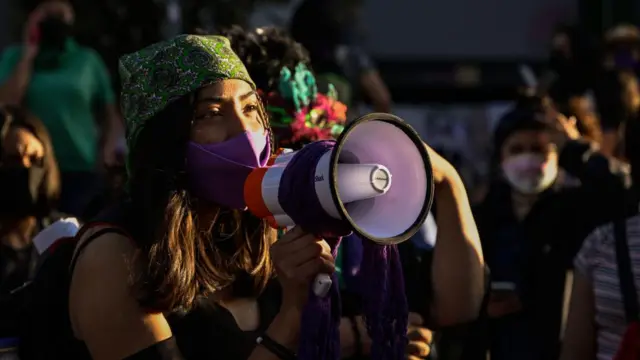 Woman talking into a megaphone