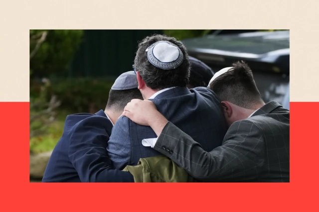 Members of the public react as they gather near the Heaton Park Hebrew Congregation Synagogue
