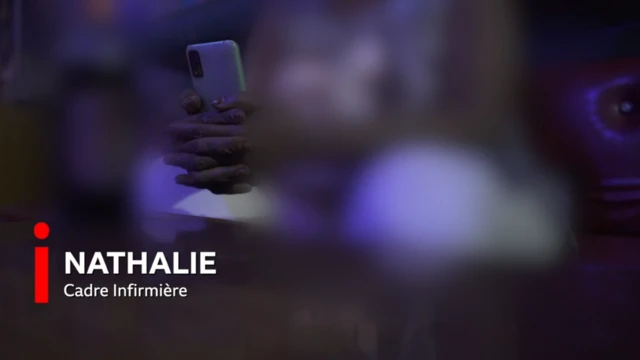 Nathalie tenant son téléphone devant une bière.