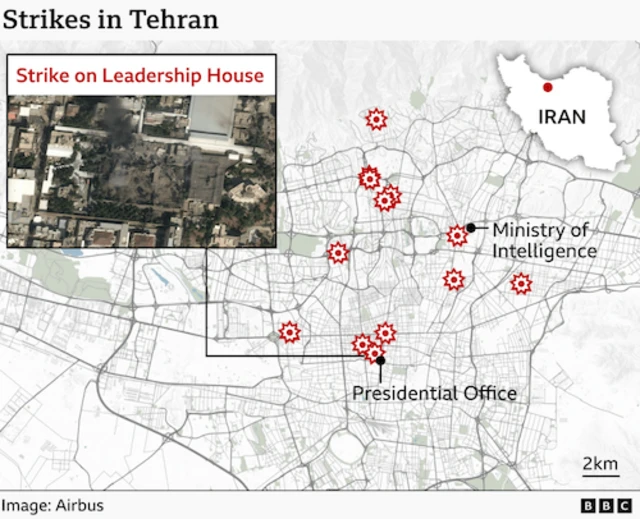 A detailed BBC map of Tehran showing the locations of several US and Israeli air strikes close to strategic locations across the city. Red explosion icons mark strike sites. One is near the Ministry of Intelligence in the north-central area. Two more are shown in the south‑central area close to the Presidential Office. An inset box on the left contains a satellite image labelled “Strike on Leadership House” showing damaged buildings and dark smoke marks. Please put your translation of all words in here for people who are sight impaired.