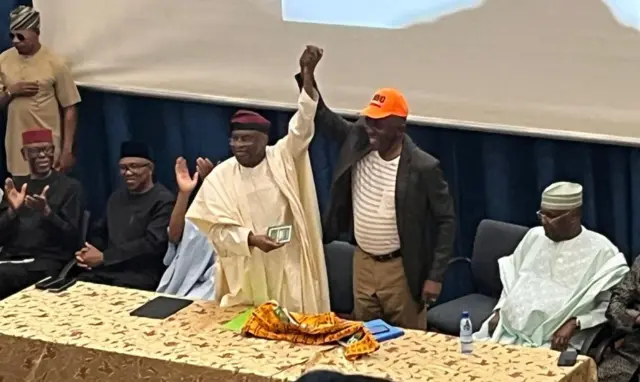 Ralph Nwosu, di founder and pioneer Chairman of di African Democratic Congress (ADC), lift David Mark hand up as di interim national chairman