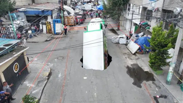 A drone view shows a soda delivery truck collapsing into a sinkhole in Iztapalapa, a borough in Mexico City, Mexico September 13, 2025, in this screengrab obtained from a handout video. IZTAPALAPA MAYOR'S OFFICE/Handout via REUTERS THIS IMAGE HAS BEEN SUPPLIED BY A THIRD PARTY. NO RESALES. NO ARCHIVES. MANDATORY CREDIT.
VERIFICATION: -Reuters was able to confirm the location from satellite imagery of area. -Reuters was able to confirm the date from social media accounts capturing the accident.