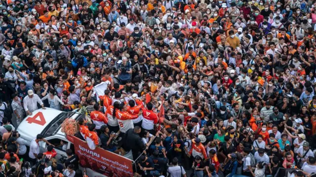 BANGKOK, THAILAND - MAY 15: A large crowd of supporters try to reach the Move Forward Party members including Pita Limjaroenrat while attending the rally to celebrate the winning of the Move Forward Party in Thailand general election on May 15, 2023 in Bangkok, Thailand. Thailand held its general elections on May 14, where the votes reveal a major win by opposition parties, with the progressive Move Forward Party leading and populist Phue Thai Party in second place.