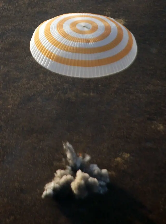 Russian Soyuz space capsule with cosmonauts Sergei Volkov and Oleg Kononenko and US space tourist Richard Garriott on board lands near the Kazakh town of Arkalyk, in northern Kazakhstan, on 24 October, 2008.