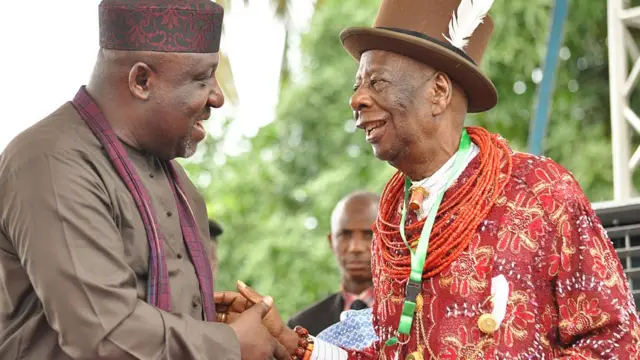 Ogoniland King Godwin Gininwa (R) shakes hand with Imo State Governor Rochas Okorocha