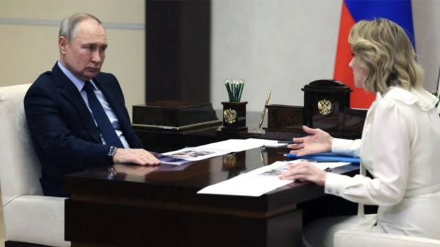 Russian President Vladimir Putin meets with Maria Lvova-Belova, Russian children's rights commissioner, at the Novo-Ogaryovo state residence, outside Moscow, on February 16, 2023