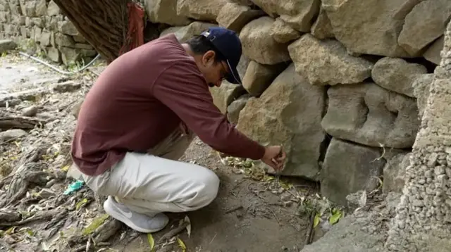 Dr Mohsin Ahsan looking for a scorpions during a field trip