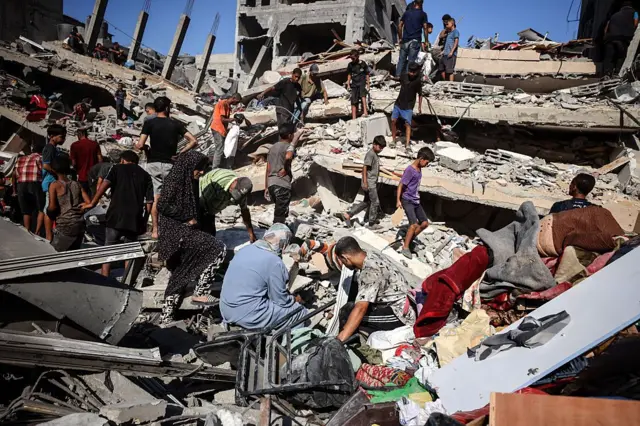 Palestinians are taking a peek for rescue things within the ruins of destructive houses that collapsed moments after they had been bombed by an Israeli air strike on yesterday, in Gaza City, September 12, 2025.