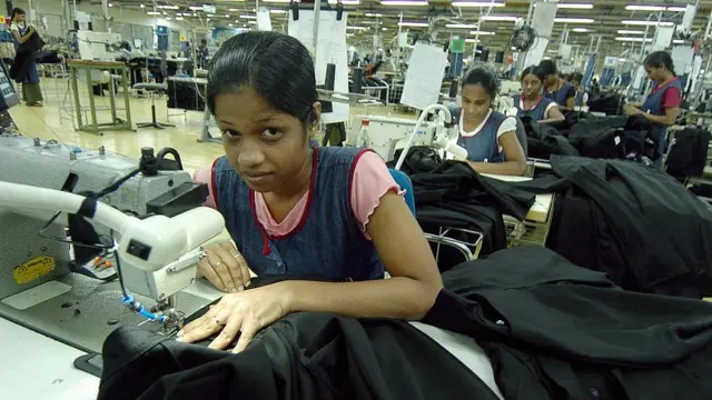 In this photograph dated 15 June 2007, Sri Lankan garment factory worker Dinendra Priyadarshani stitches a pair of denim jeans for a top international label at a factory in Avissawella