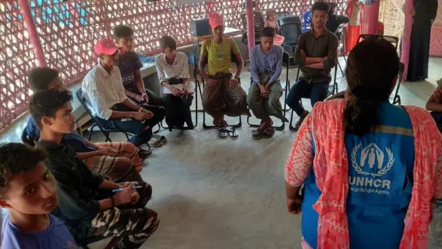 A UN awareness camp being conducted in a refugee camp