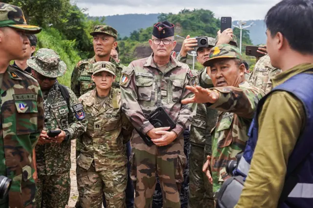 Foreign military attaches from major powers and ASEAN member countries, along with diplomats from 13 countries, inspect the closed An Ses border checkpoint, after the leaders of Cambodia and Thailand agreed to a ceasefire on Monday effective midnight, in a bid to bring an end to their deadliest conflict in more than a decade, while Thailand's military accuses Cambodia of second ceasefire violation and wait for Cambodia’s invitation for bilateral talks on August 4, Cambodia, July 30, 2025. REUTERS/Soveit Yarn TPX IMAGES OF THE DAY