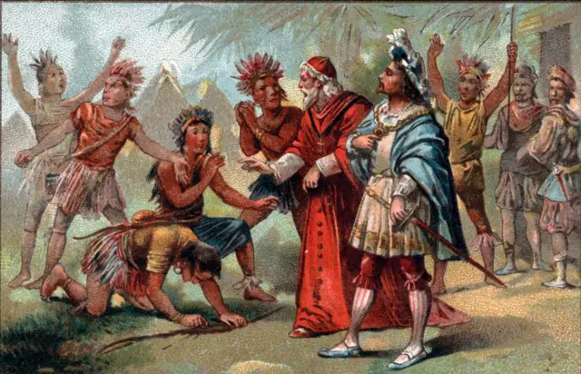 Bartolomé de las Casas, con una túnica roja, al lado de un hombre vestido con ropa europea y una espada. Están cerca de un grupo de indígenas que llevan sus atuendos tradicionales