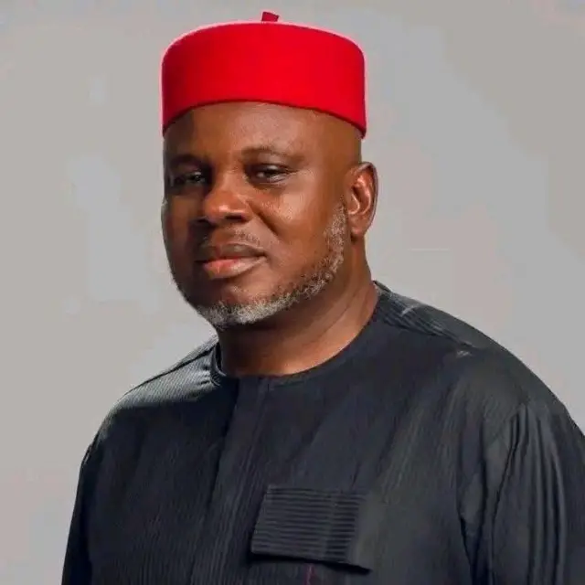 Nicholas Ukachukwu wear red cap and black cloth