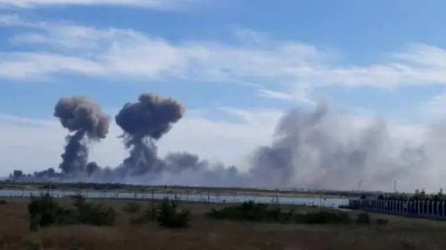 Smoke rises after explosions were heard from the direction of a Russian military airbase near Novofedorivka, Crimea, in this still image obtained by Reuters August 9, 2022