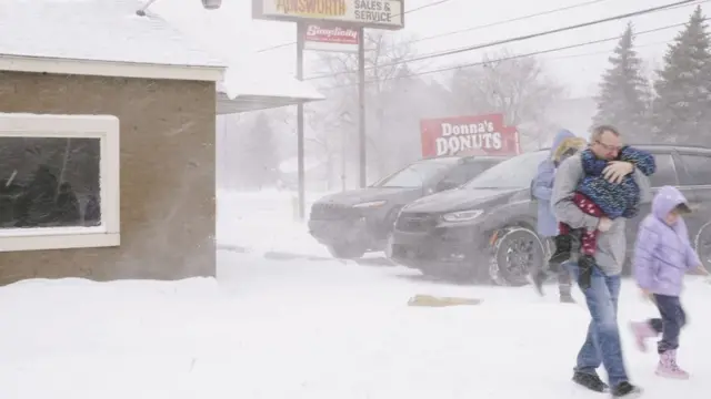 A family huddled together in Flint, Michigan