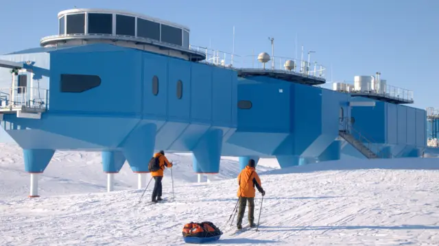 Two members of staff skiing outside the Halley VI Research Station
