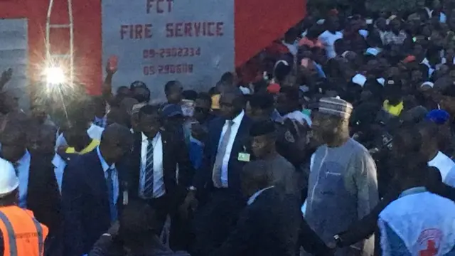 Nigeria acting Presido Yemi Osinjo and FCT minister rush go wia di building fall for ground inside di capital city for Nigeria.