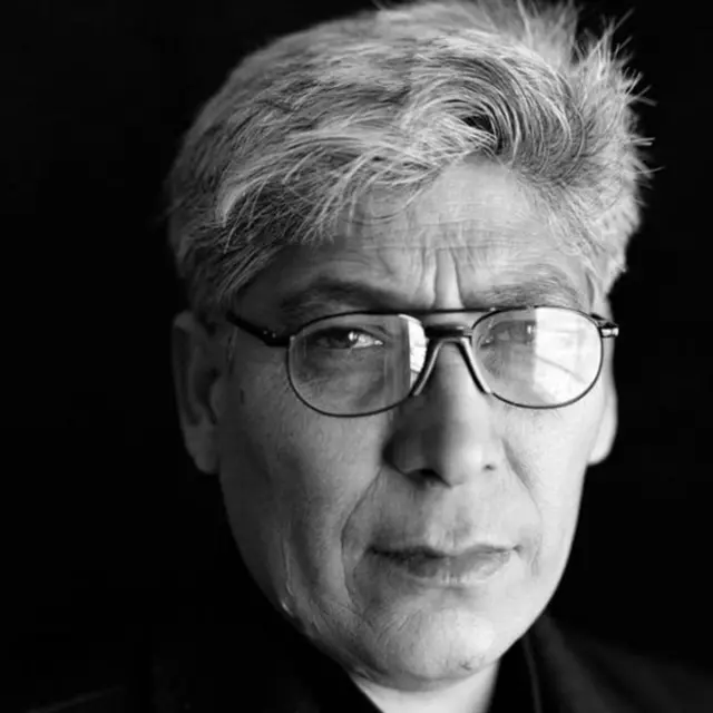 Ali al-Qaisi posed for a formal portrait of himself