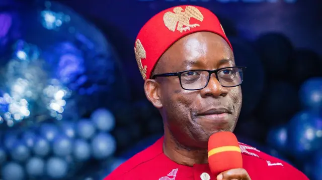 Charles Soludo speaking into a mic