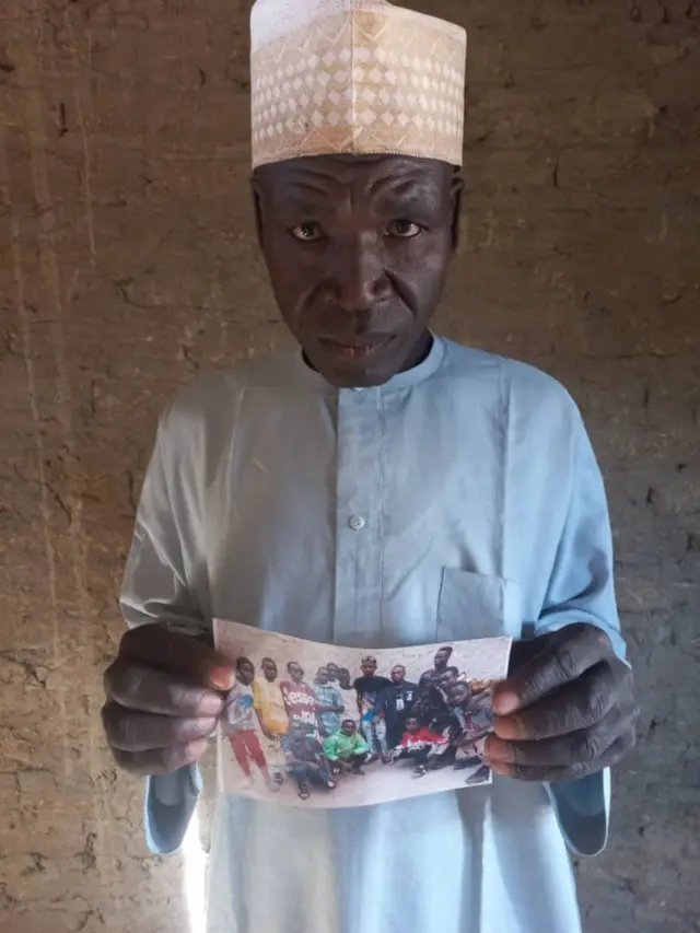 Papa holding picture