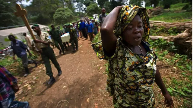The funeral of ICCN Ranger Kambale Kalibumba, 36, at Mutsora Ranger Station. He was killed by a rogue FARDC Congolese soldier in 2008