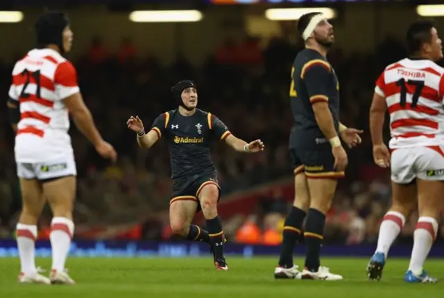 Sam Davies kicks a drop goal