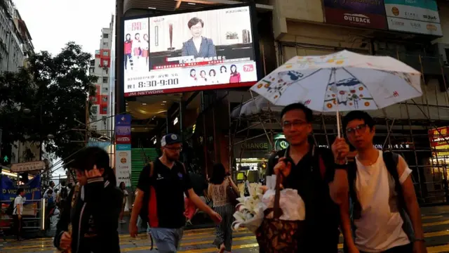 Carrie Lam broadcast seen on the streets of Hong Kong