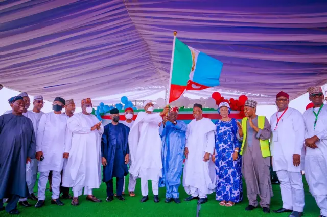 Bola Tinubu receive APC flag from President Buhari 