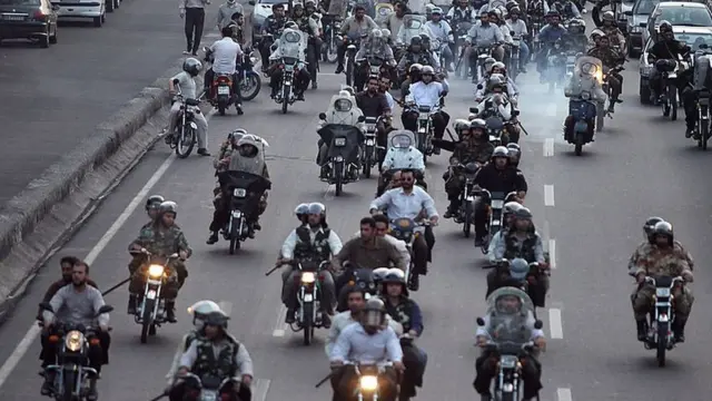 Iranian Basij ride motorcyles while policing a demonstration on July 9, 2009 in Tehran, Iran.