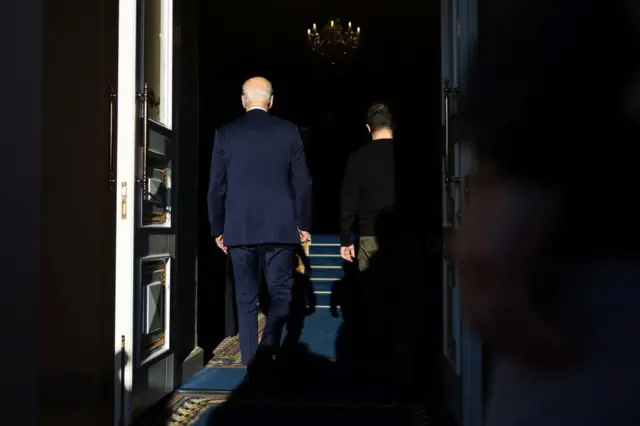 Biden and Zelensky walk into the Ukrainian presidential palace