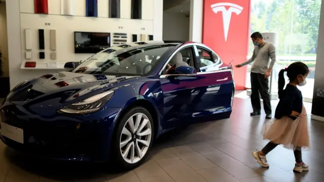 Visitors at a Tesla showroom in Beijing