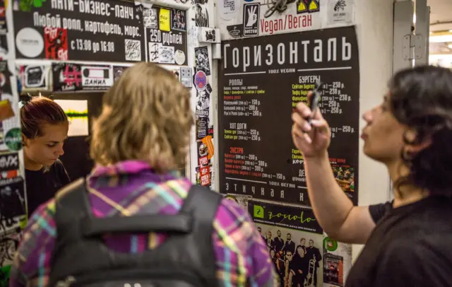 Varya serving customers at Horizontal'